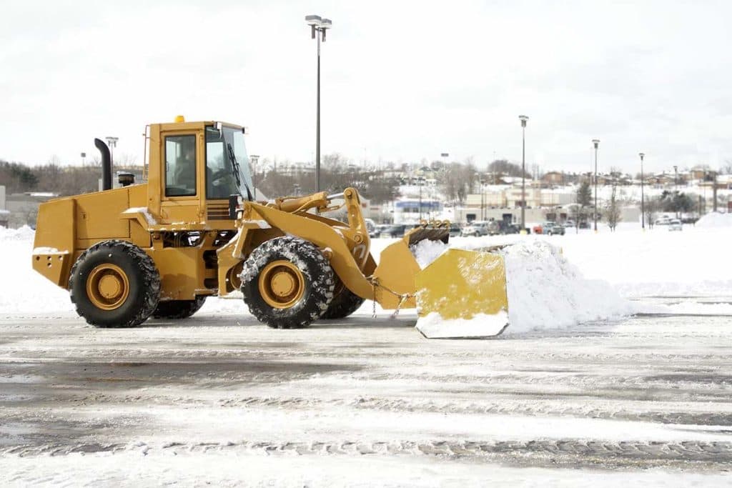 Snow removal tractor at work